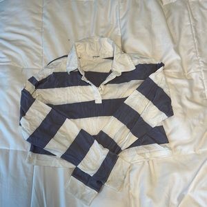 Small long-sleeved purple and white, cropped, cotton button up shirt.
